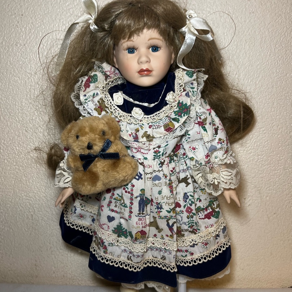 Porcelain Doll with Brown Hair and Teddy Bear